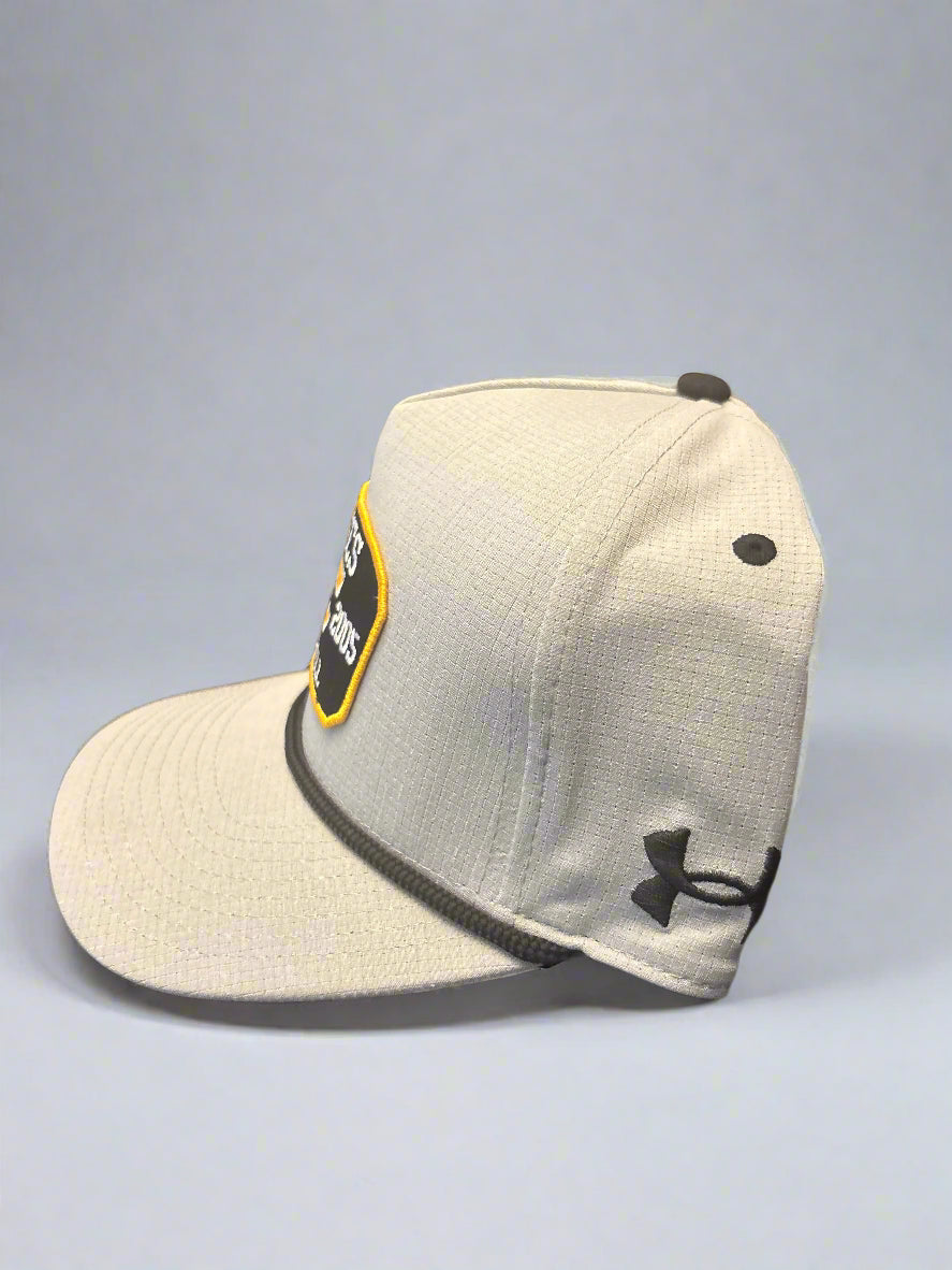 Gray cap with a logo on a dark surface