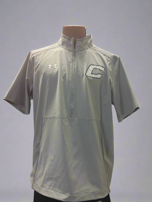 Gray sports shirt with logos on a mannequin against a gray background