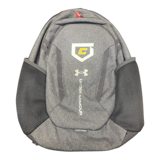 Gray backpack with Under Armour logo/Canes logo, a shoulder strap and multiple compartments.